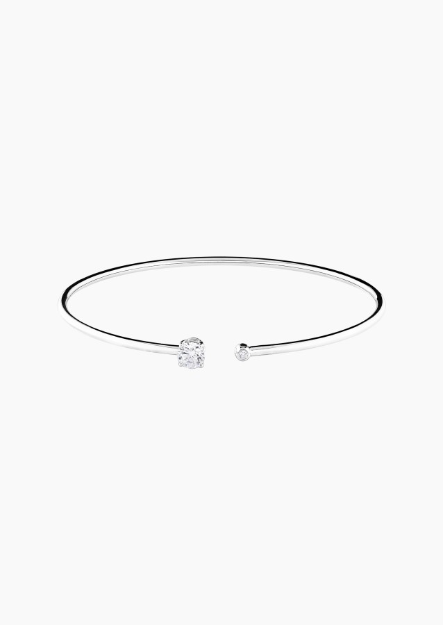 
                                                                                    Béguin flexible bangle bracelet in white gold with diamonds – Maison Lepage, French jeweler and designer since 1922.
                                                                            