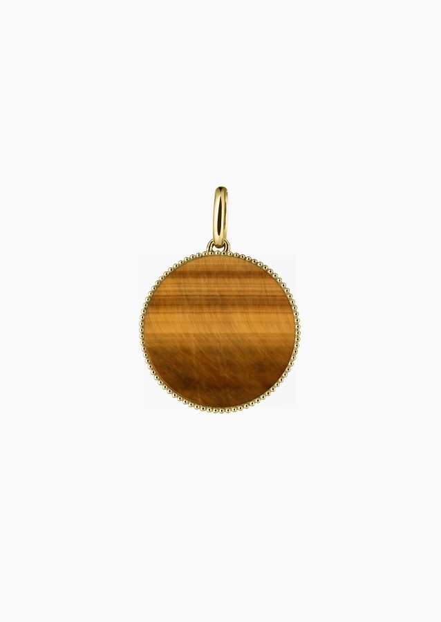 
                                                                                    Colette Lune Perlée 15 mm medal in yellow gold with tiger’s eye – Maison Lepage, French jeweler and designer since 1922.
                                                                            