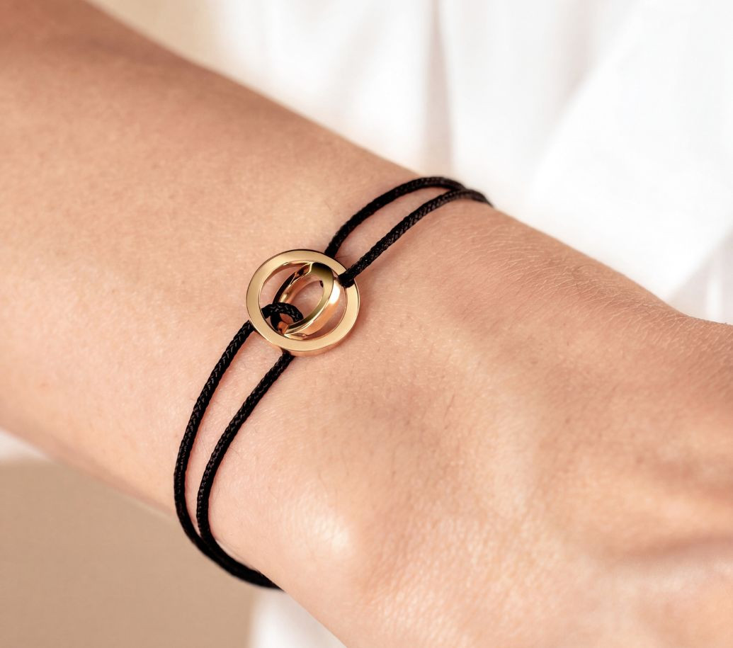 bracelet alba or jaune et cordon noir